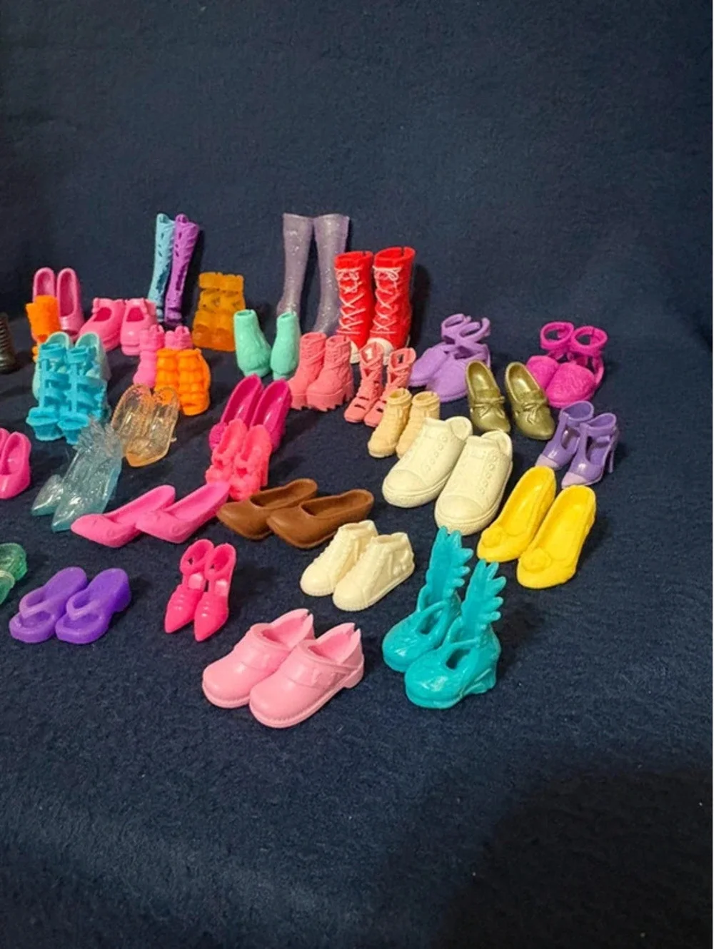 46 Matching pair of small dolls, Barbies, and Ken shoes